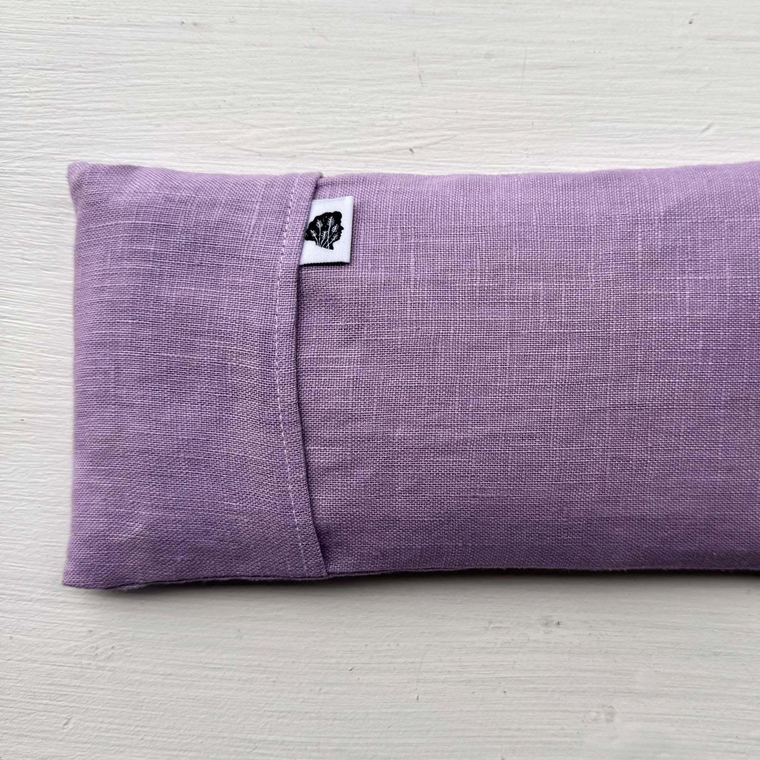 Purple eye pillow with TLC tag