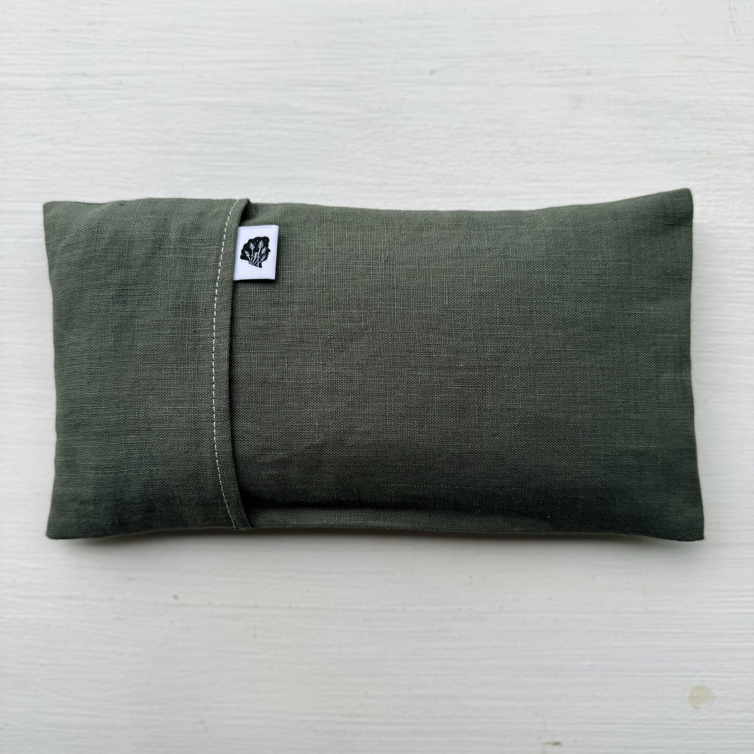 Sage green eye pillow with TLC tag