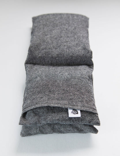 Charcoal linen wrap folded on white with TLC tag