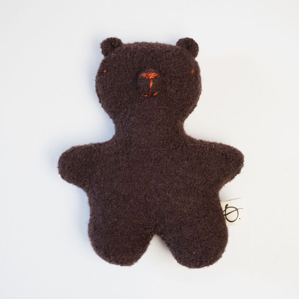 Brown teddy bear on white