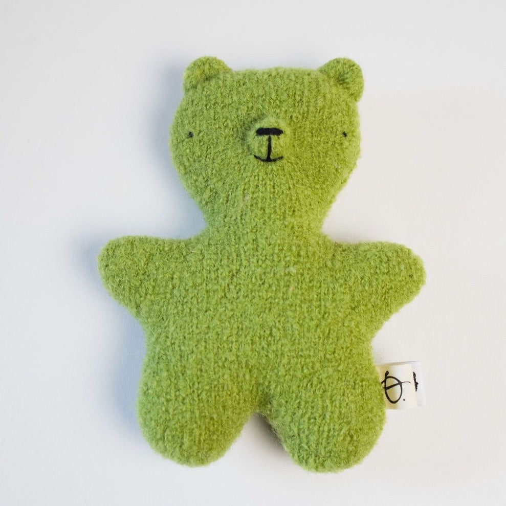 Lime green teddy bear on white background