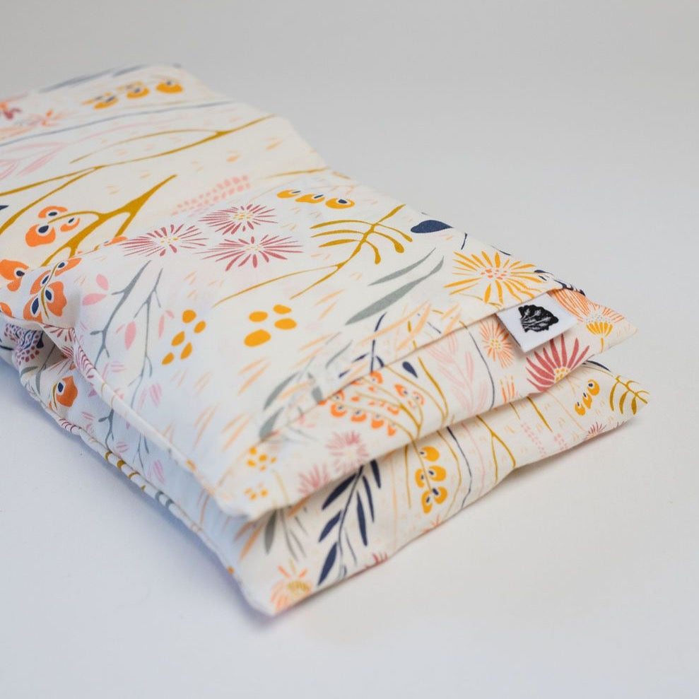 Close up detail of folded light floral wrap